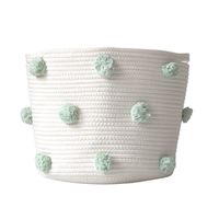 "The Mint Pom basket (LARGE) is one of our best sellers for a good reason! Not only is it the perfect shade of mint green, but it is also the perfect addition to any room in your home. With endless possibilities, this basket can be used in so many ways. Use it for books, store rolled up blankets, or - even your little one's toys. Hide the clutter without sacrificing style. Each basket features 18 hand-dyed poms in mint green. -12\"h x 15\"w -Two sewn-in handles. -Made responsibly in Canada. -Non-toxic, eco-friendly cotton rope. Care: Gently spot-clean with a soft, damp cloth. Do not machine wash."