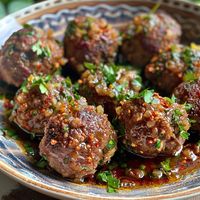 Savory Beef Meatballs Recipe (Serves 6) These savory beef meatballs are packed with flavors, combining the rich taste of ground beef with a delightful blend of spices and herbs. Perfect as an appetizer, main dish, or a delicious addition to pasta. Ingredients For the Meatballs: 1 1/2 pounds (680 g) ground beef 1/2 cup (50 g) breadcrumbs 1/4 cup (60 ml) milk 1/4 cup (30 g) grated Parmesan cheese 1 large egg 1 small onion, finely chopped 3 cloves garlic, minced 2 tablespoons fresh parsley, ch...