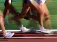 size: 24x18in Photographic Print: Detail of Blurred Action of Legs in Womens Race by Steven Sutton :