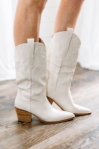 Thee boots are highly thought of and regarded around here! They are so cute and we love their classic Western style! These sassy boots are right on trend and we are loving these babies for pairing with dresses!  Run about half a size small. Consider sizing up a half size.Cam is wearing the size 7. Actual product colors may vary from images shown due to different viewing devices and lighting.