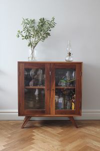 Mid century inspired fsc walnut & glass cabinet for drinks, glasses, China, books or whatever you want to put in it on display.  Size 800mm x 800mm x 370mm Hand made with hand picked walnut, grain matched/waterfall grain for the best possible outcome, this piece really is beautiful.  Available in walnut, oak, maple, teak, ash & elm.  Can also be made to any size.