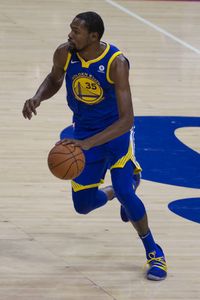 Kevin Durant of the Golden State Warriors drives to the basket against the Philadelphia 76ers in the second quarter at the Wells Fargo Center on...