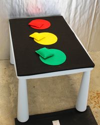 Toss the bean bag on the right color of the stop light. Easy and fun for any toddler.