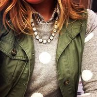 Polka dot sweater, green army vest, & sparkly necklace.