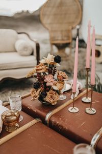 Create a central focal point in a boho wedding lounge area with vintage furniture and trunk rental from Orange Trunk Vintage Rentals in Alberta, Canada.