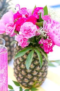 Make a vase out of a pineapple! Party like a PINEAPPLE! Girl's Game Night, tropical style, with free printable too! Pizzazzerie.com