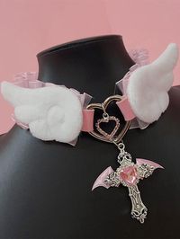 Elevate your Kawaii fashion game with our rhinestoned cross pendant blue/pink Jirai Kei angel wings PU choker. This stunning choker features a delicate PU leather band adorned with a rhinestoned cross pendant in a choice of blue or pink, perfectly capturing the ethereal essence of Jirai Kei style. The angel wings design adds a touch of whimsy and fantasy, making it a must-have accessory for any Kawaii wardrobe.  Please note that this product includes the choker only.