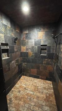 Difficulty: Difficult     Material  • Schluter systems Kerdi Membrane  • Schluter Allset  • Schluter 5-1/4 drain adapter kit  • Schluter tillable drain  • Schluter recessed niches  • Cement board  • 12x12 slate  • 4x8 porcelain tile  • Cocoa grout  • Schluter jolly trim  • Stone sealer