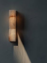 This Alabaster Essence Wall Sconce is crafted from rich alabaster material, making it a timeless LED light and decorative accessory. The solid stone is intricately carved to perfectly create intentional internal curves, inspired by the palpable energy felt upon two forms coming into contact.   Note: Due to the narrow width of this wall lamp, it is not compatible with the standard American JBOX junction box. This lamp requires a specially sized junction box to ensure a proper fit; otherwise, gaps