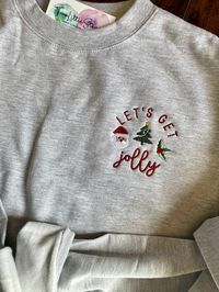 Let's Get Jolly Embroidered crewneck sweater **Free Shipping** A comfy cozy pullover crewneck in multiple seasonal colors. 9 oz 80/20 cotton/polyester blend Split stitch double needle sewing on all seams Twill neck tape 1 x 1 ribbing at neck, cuffs and waistband