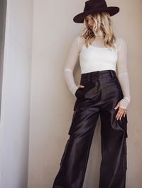 Entering our edgy era with the Reese Faux Leather Cargo Pants. Unleash your inner rebel with these bad boys. Meet your new statement piece.