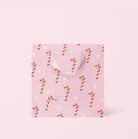 Add a special touch to your gifts this season with our Candy Cane Holiday Gift Bag. Our paper gift bags are available in two different sizes, are made of FSC certified sustainably sourced paper, and feature 100% cotton Grosgrain Ribbon handles. Small | 6" x 3.5" x 6.5" Medium |8" x 4" x 10"