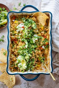 This Green Chile Rice Bake is the perfect one-pot dinner. Veggies, rice and beans are tossed together in a casserole dish and baked!