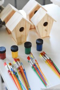 A Camp-In Sleepover! Birdhouse painting activity for a Camping Sleepover Birthday Party! How fun is this! It's all so cute!!! Camping Sleepover Birthday Party Ideas! Pottery Barn Kids, fake fire, tents, sleeping bags, fire birthday cake, kaleidoscope, birthday banner.