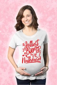 Add a festive twist to your maternity wardrobe this holiday season! Our 'The Jolliest Bump This Side Of The Nuthouse' T-shirt is not just a statement-maker but a comfort guarantee. Crafted from high-quality fabric, this maternity tee ensures a perfect fit for your changing body, letting you enjoy the Christmas spirit while looking fabulous. It's more than a shirt, it's a celebration of your pregnancy journey!