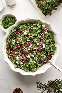 Kale salad with pomegranate vinaigrette is just in time for Christmas. It's a beautiful and festive side dish for any holiday dinner!