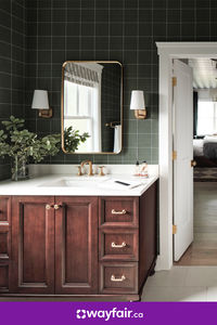 We can't stop obsessing over this modern bathroom. Want to bring the look home for yourself? Shop hundreds of wooden vanities, gold hardware, and green wall tiles to make this look yours.

Photos © 2023 Warner Bros. Discovery, Inc. or its subsidiaries and affiliates. All rights reserved.