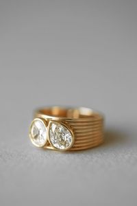 This one-of-a-kind ring pairs two sparkling champagne diamonds—round & pear—with a chunky ridged band.