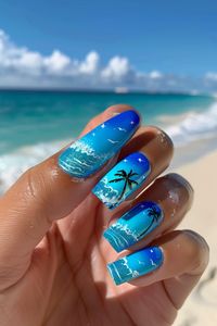 Step onto the sandy beaches with these tropical nails featuring a palm-lined shore and sparkling waves, ideal for capturing the essence of summer nails. Whether it's a beach vacation or just a daydream, find your perfect beach nail design at nailhow.com.