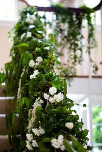 Outdoor summer garden wedding with romantic details like this staircase floral installation covered in green vines and white floral | FLORA NOVA DESIGN SEATTLE