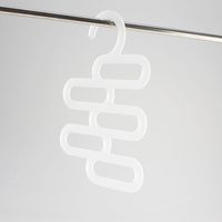 Acrylic hanger for holding multiple ties, integrated hook for use in wardrobes.