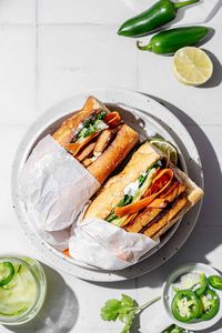 Need an easy lunch or weeknight dinner? Try out this charred tofu bánh mì! This plant-based Vietnamese-inspired bánh mì features super flavorful, pan fried tofu and quick pickled carrots and cucumber piled high on a crunchy toasted baguette. Smear on a layer of creamy vegan mayo, and top everything off with thinly sliced jalapeño, and loads of cilantro for an easy, filling sandwich. This sandwich is fast, simple vegan and vegetarian friendly! #tofurecipe