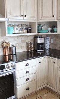 Raised wall cabinets with shelves built underneath. Namely Original: Painted kitchen and remodel reveal CabinetsAndDesigns.net