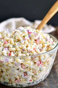 You can’t have a BBQ party or a potluck without some delicious Macaroni Salad. This is our favorite Macaroni Salad full of red onions, celery, bell peppers, herbs, and of course, delicious creamy dressing. #pasta #macaroni #salad #bbq #bbqsides #bbqsidedish