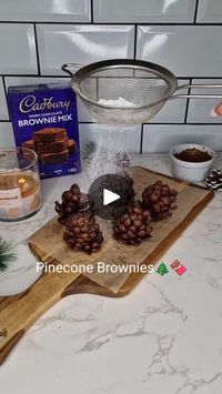 2.6M views · 5.8K reactions | Pinecone Brownies🎄🍫 - Yum! Here’s the RECIPE ⬇️ 

Ingredients:
- Brownie mix (just add 2 eggs, milk, melted butter, and a splash of vanilla)
- Melted chocolate 
- Coco pops chocos
- Icing sugar 

METHOD:
1. First, bake your brownies according to the package instructions, then crumble them up.
2. Get your hands messy and shape the brownie crumbles into balls, then form them into cute cone shapes! 
3. Dip those brownie cones into the melted chocolate for a delicious coating.
4. Gently press the coco chocos onto the outside to make them look like pine cones.
5. Finally, sift a little icing sugar over the top to give them a lovely snowy look. 

😋 Then Enjoy!

#Christmas #baking #easybaking  #christmaspudding #christmas2024 #christmasfood #christmastreats  #chri