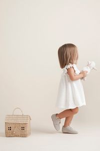 Made with 100% cotton, this knit baby girl dress is sure to become a summer staple in your child's wardrobe. Features a knit diaper cover and a-line silhouette with flutter sleeves and yoke. Vintage-inspired style it's sure to be cherished as a keepsake for years to come.