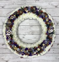 If steam punk was their thing then this Wreath maybe worth saving in a board. We are honoured to be asked to create such bespoke, special tributes. This wreath with a hessian edging, crisp white chrysanthemum and a ring of wall headed flowers and cogs is a bespoke design by Signature Flowers, Bicester   #funeral #funeralflowers #steampunk #steampunkart #floristry