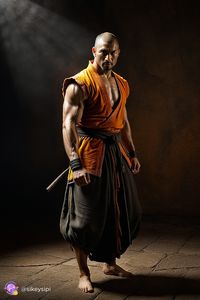 This image, generated by the Stable Diffusion program, represents a warrior monk who finds serenity even in the most tense combat situations. He is dressed in orange clothes and black decorations, which highlights his uniqueness. #ZenWarrior #BattleMonk #Serenity