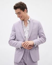 Made in a vibrant lavender hue, this suit blazer designed in a sleek slim fit is sure to elevate your style. Whether you want to bring some colour to your daily life or wear on a special occasion, this blazer has got you covered. Matching suit pant available.  - Slim fit through the chest and waist - Stretch woven fabric - Contains recycled polyester - Notch collar - Two-button closure - Chest pocket - Flap pockets and inner pockets - Back vent - Lined - Sleeve length from centre back: 35'' (siz