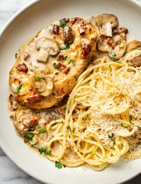 This Chicken Riesling recipe is so simple to make at home. It's a restaurant favorite that has bacon and mushrooms in an irresistible creamy white wine sauce that's paired with parmesan pasta!