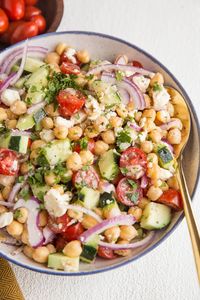 Mediterranean Chickpea Salad - Mediterranean Chickpea Salad with cucumber, cherry tomatoes, feta cheese, and a zesty lemon dressing makes for a healthy side dish.