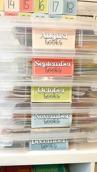 Ashley | Modern Classroom Decor on Instagram: "Read Aloud Book Hack & FREEBIE✨ Grab these monthly read aloud labels for ✨FREE✨ in my TpT store to help organize your monthly read aloud books! Head to my bio for a quick link! 🤍 The 12x12 IRIS scrapbook containers (along with these labels) are the perfect solution for storing & organizing monthly read aloud books! PLUS the containers are on SALE for $4.99 right now at Michaels!! 👏🏻👏🏻 These levels are part of the Happy Brights Classroom Decor C