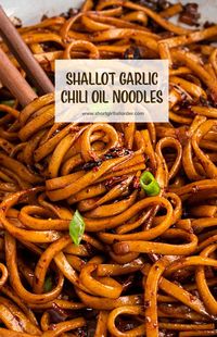 These spicy chili oil noodles are made with shallots, garlic, & a homemade Chinese chili oil sauce served over udon or ramen noodles. You will love this easy & vegan chili oil noodle recipe with garlic & shallots! #chilioilnoodles