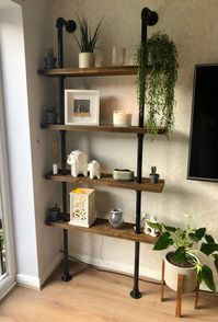 Created from galvanised steel tubing and our best-selling rustic shelves, our industrial shelving units add the ultimate wow-factor to any room. Practical, decorative and chic with a unique rustic flare, these shelving units can be designed to any specification and with any room in mind. Finished in a high quality wax finish. Clean using a damp cloth. Avoid harsh chemicals as this may affect the colouring. Get in touch to confirm any bespoke dimensions, including doubling up on shelving to creat