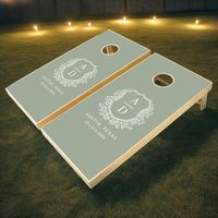 Add a touch of elegance and fun to your wedding celebration with the Modern Monogram Wedding Floral Crest Cornhole Set. This beautifully designed set features a chic floral crest with your personalized monogram, blending sophistication with a playful element.