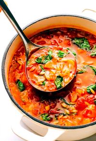 This Italian Orzo Spinach Soup is simmered with hearty pasta, veggies, greens in a zesty tomato-herb broth, then served warm with lots of Parmesan and fresh basil. It's one of our favorite vegetarian 30 minute meals, but feel free to add in sausage or chicken too if you'd like! | gimmesomeoven.com