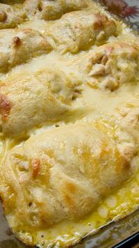 Chicken Roll Ups ~ Heaven in a pan... chicken breasts wrapped in crescent rolls and smothered with cream of chicken soup, milk and cheese... Delish!