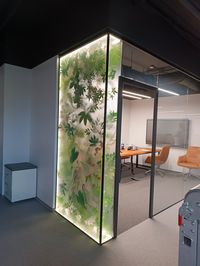 artificial plants behind white frosted glass