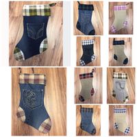 Denim/Corduroy/Khaki Christmas Stockings with flannel toe/heel and bands. All stockings are lined, and are ready to hang! See below for descriptions. #1: Denim stocking, Green/Red/Yellow/White flannel #2: Grey denim stocking, Green flannel #3: Denim Stocking, Brown flannel #4 Khaki Stocking, Pink Flannel #5: Denim Stocking, Green/Blue flannel #6: Denim Stocking, Pink/Tan Flannel #7: Light Grey Stocking, Green/Red/Yellow/White Flannel #8: Khaki Stocking, Blue/White Flannel #9: Dark Denim Stocking