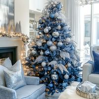 A blue Christmas tree featuring silver tinsel and sparkling ornaments adds elegance to your festive living room.