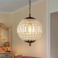 Combining stylish functionality with classic vintage charm, this charming globe crystal chandelier casts a dazzling glow in your dining room or entryway. Crafted with a metal frame and high-quality crystal, the metal frame is wrapped handmade with crystal wire to give this fixture a special and texture look, and create a warm ambiance. Available in 3 sizes and hung by a 59-in adjustable chain and mounted by a sloped ceiling-compatible canopy, this classic pendant chandelier definitely fits any p