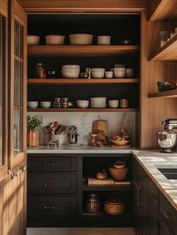 Optimize your kitchen pantry with functional Japandi design. This style merges the clean lines of Japanese aesthetics with the practicality of Scandinavian design, resulting in a space that is both beautiful and efficient. With an emphasis on natural wood, neutral tones, and smart storage solutions, a Japandi pantry design enhances the flow and organization of your kitchen, creating a peaceful and clutter-free environment. #JapandiDesign #FunctionalPantry