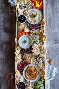 Greek appetizer platter is the perfect make-ahead party food for your next dinner party, game day, or weekend happy hour. Basically, this is an epic Mediterranean-inspired charcuterie board full of pita, hummus, tzatziki. If you're looking for a party platter to impress, you have to try this recipe twist on the authentic fresh and tangy flavors of Greece. #easygreekrecipes #greekfoodrecipes #greekappetizers #greekdinnerparty