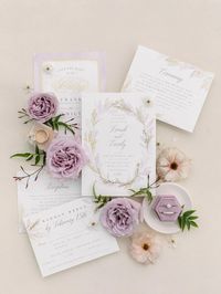 Wedding detail photos are so important to help remember the day, flat lay with invitation, rings, and romantic pastel spring flowers.