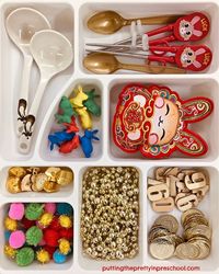 This rabbit-themed Chinese New Year loose parts tray is filled with treasures early learners love to explore. #ChineseNewYear #ChineseNewYearactivities #looseparts #playbasedlearning #ChineseNewYearbin #sensorybin #sensoryplay #preschoolactivities #kindergartenactivities