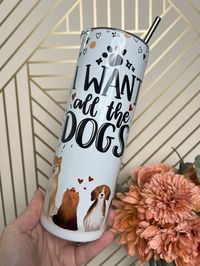 "Introducing our irresistibly cute 'I Want All the Dogs' 20oz Metal Tumbler--the perfect gift for dog lovers and a must-have for anyone who appreciates unique, charming drinkware. Using state-of-the-art sublimation print technology, our custom design features a variety of adorable dogs, sure to bring a joyful woof to your sip! Crafted with love, this eco-friendly tumbler is not just a treat for the eyes but also for the Earth. 🐾 Features: Eco-friendly alternative to disposable cups, for those w